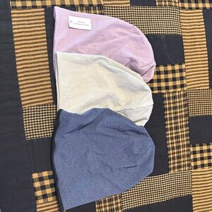 Set of Three Knit Beanies in Pink, Cream, and Blue